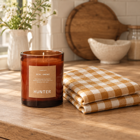 Hunter James Yuzu + Smoke candle with a Toffee Gingham French linen tea towel
